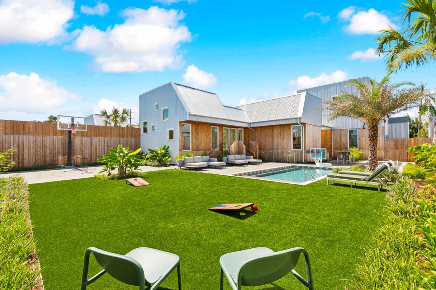 Modern Castleday Retreats villa with private pool, lawn, and basketball hoop